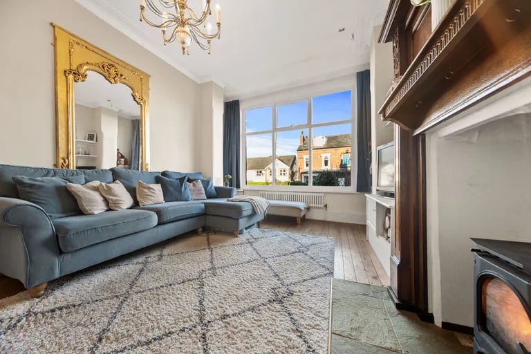 The very god size living room is bright and airy.