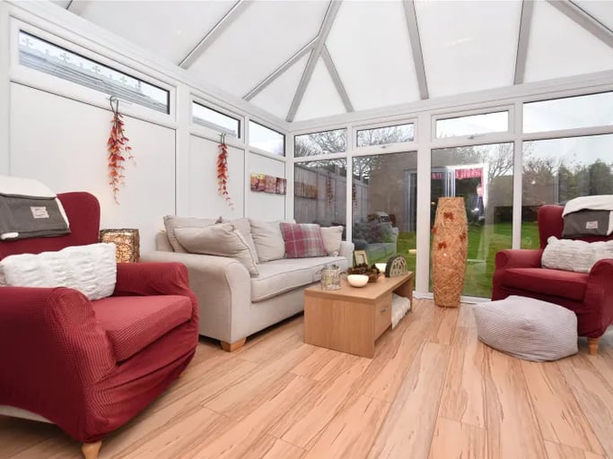 The lovely conservatory extension with access to the large gardens.