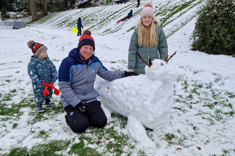 Andrew, Olivia and Euan Hogg enjoy of Broomhill enjoy the snow at Crookes Valley Park