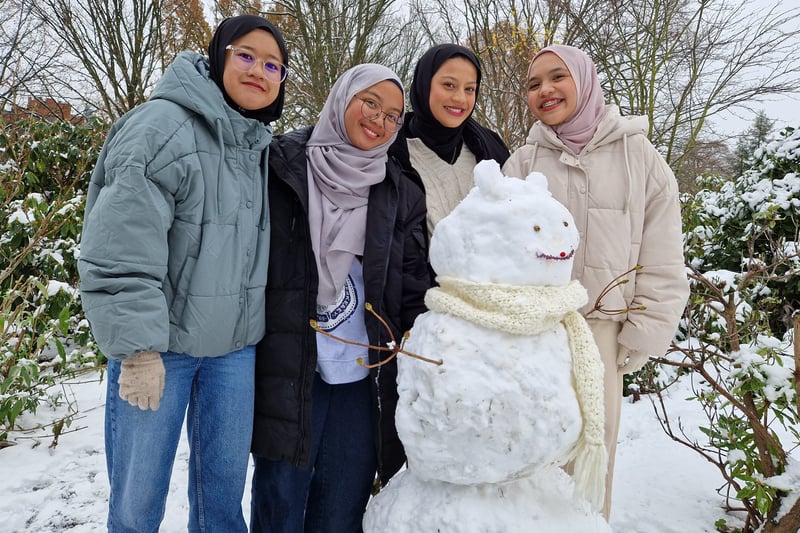 Students from the University of Sheffield show off their snowbear 