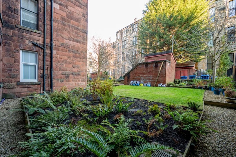 The neat shared resident's garden to the rear is the perfect place to spend a sunny day. 