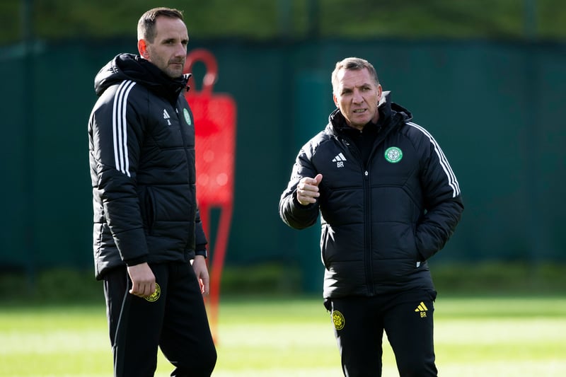 Brendan Rodgers speaks to Celtic assistant manager John Kennedy during a training session at Lennoxtown