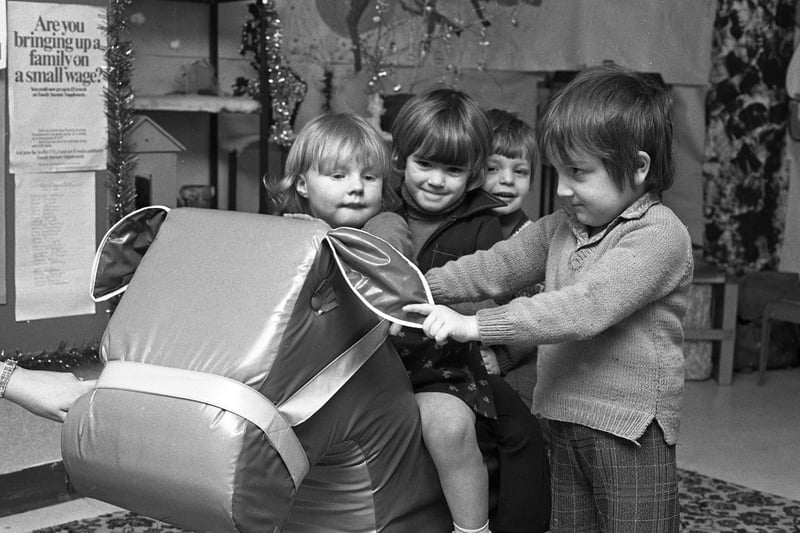 Riding a toytime donkey at Southwick Day Nursery in December 1976 were (left to right) Nora Binyon, Rachel Meteer, Paul MacDonald and Thomas Keogh.