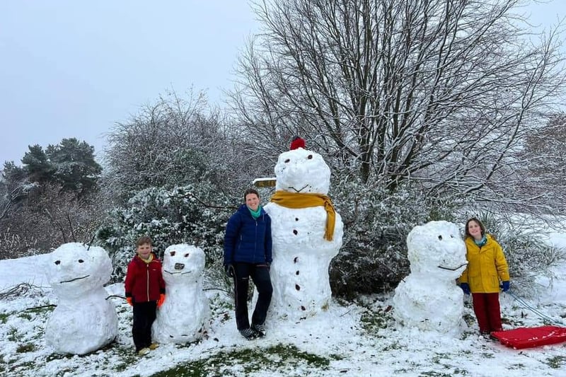 The Hardman family and their handmade snow man family in Lodge Moor. 
