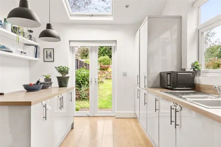 French doors to the rear garden and skylight windows add more character to the space.