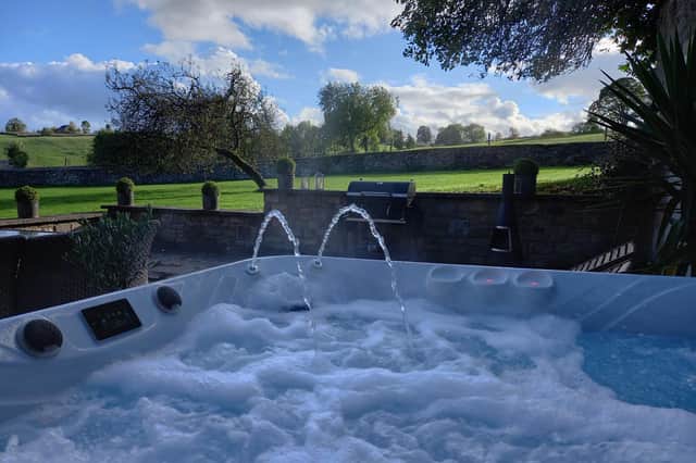 Soak in the hot tub after a day pottering around Bakewell's pretty shops and pubs. (Photo courtesy of Airbnb)
