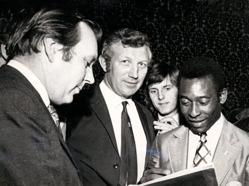 Football superstar Pele signing an autograph for Tony Pritchett, The Star's chief sports writer, in 1972