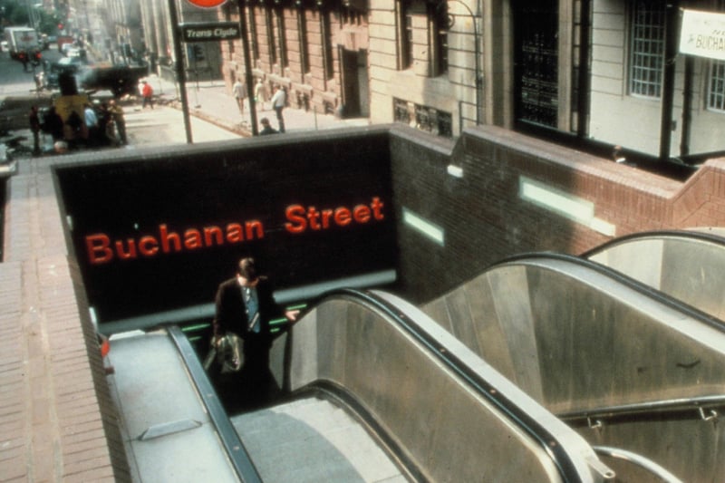 The entrance to Buchanan Street subway pictured back in the day before there was a cover over the escalators. 