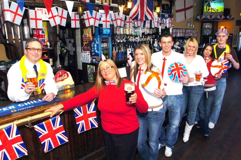 George Holliday, left, with some of the pub's customers who celebrated the Queen's 80th birthday in style in 2006.