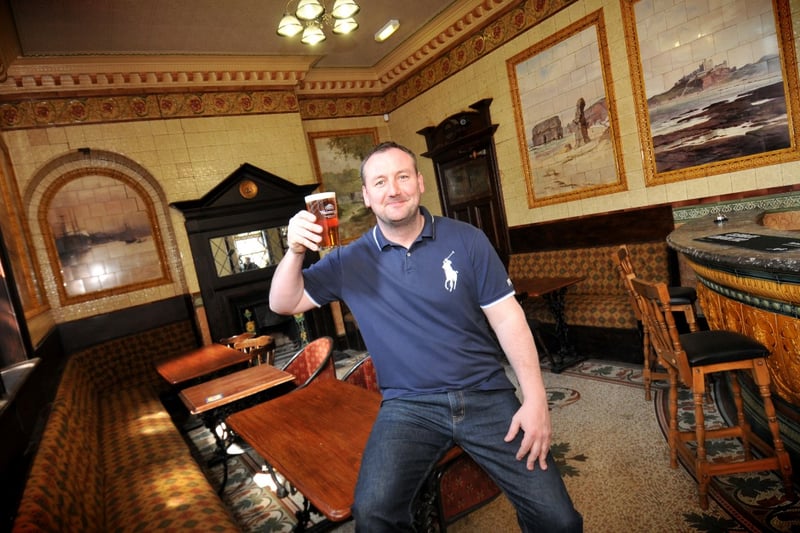 Landlord Chris Royal toasts the news that one of his pub's rooms has been singled out for a special mention by CAMRA in 2013.