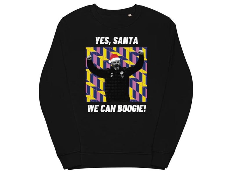 Another jumper inspired by Scotland's football team and their uncharacteristically efficient qualification for Euro 24, this features manager Steve Clarke looking festive. It's available from Fan-Fare.