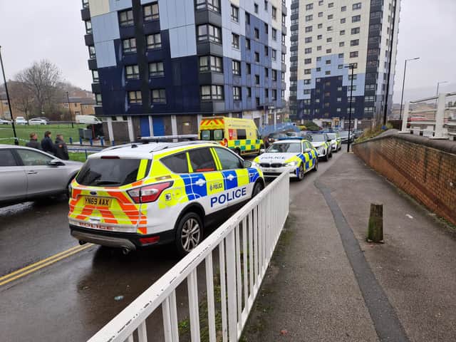 A large police presence remains at the scene after the body of a 30-year-old woman was found beneath a block of flats on Brightmore Drive, Sheffield.