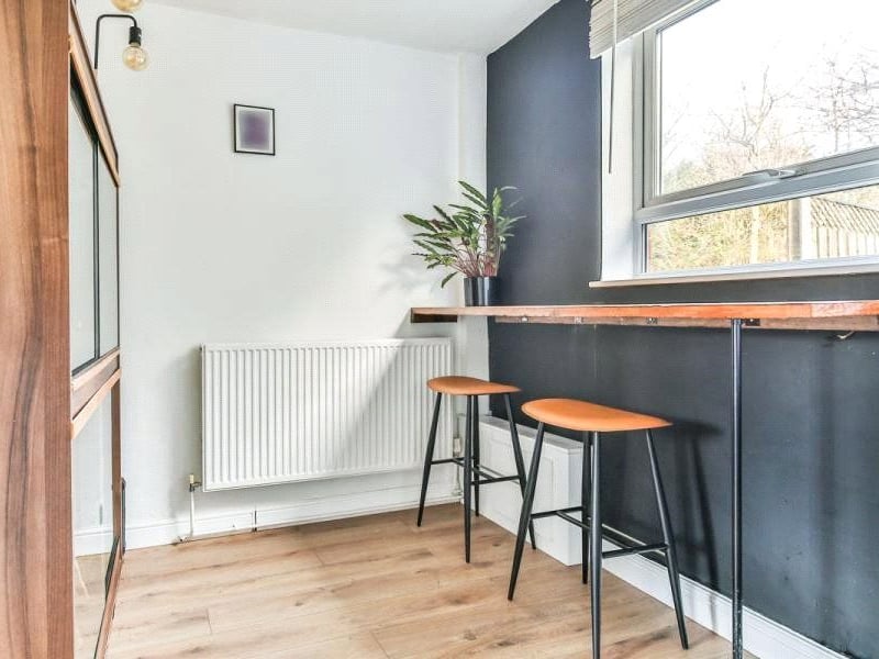 The kitchen's breakfast bar offers a lovely spot for a couple to sit and enjoy the day's most important meal whilst looking out over the garden. (Photo courtesy of Zoopla)