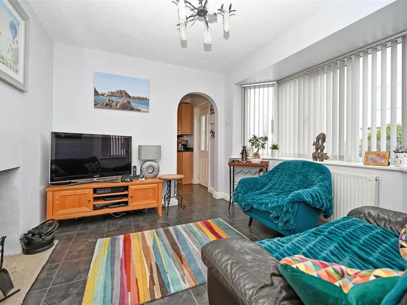 On the ground floor is also a sitting room with bay window.