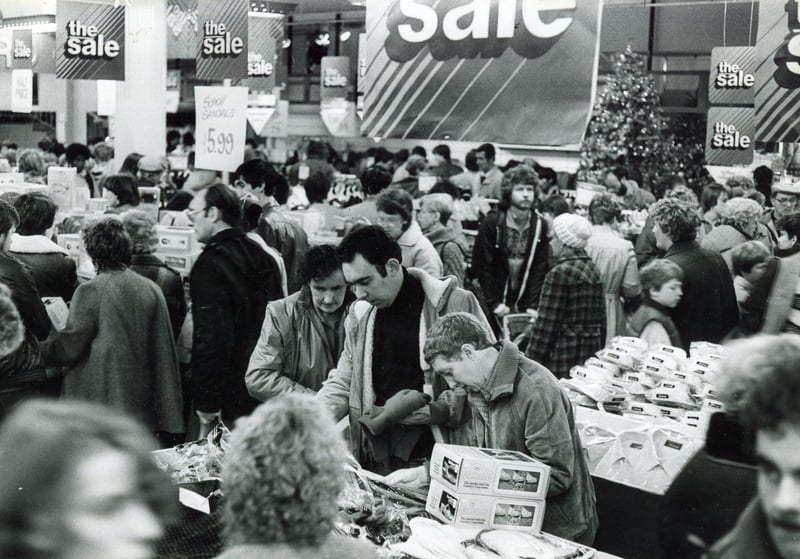 A sale at Debenhams department store, on The Moor, Sheffield, in December 1983. The store was previously Pauldens, which opened in 1965, before becoming a Debenhams in 1973.
