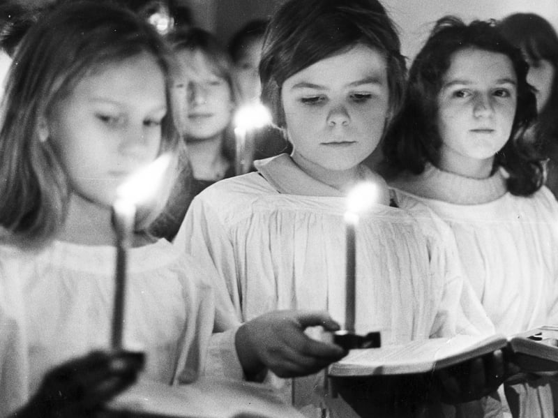 The Junior Choir of St. Silas Church, Sheffield, as they assemble for the Advent Carol Service held by candle light in December 1973