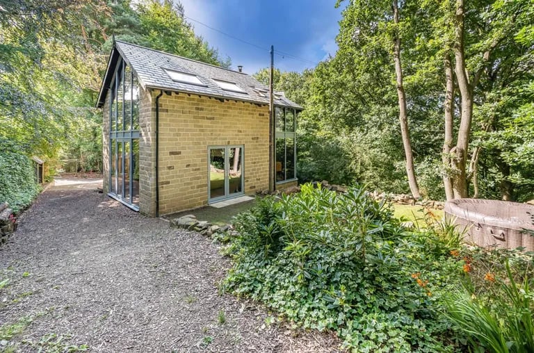 It is set in a woodland area with a stream and large meadow.