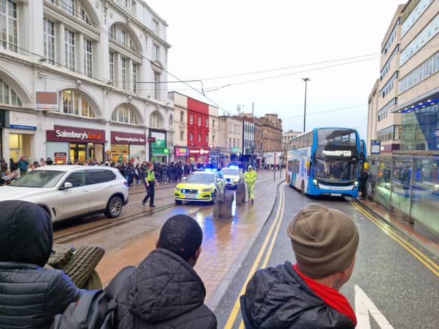 Armed police have stopped traffic and trams along High Street in Sheffield city centre. 