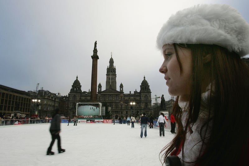 A skater takes to the ice on the temporary rink installed in George Square for the Christmas season. 