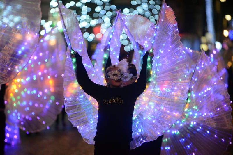 A dance school spreading their wings in the Winter Parade.