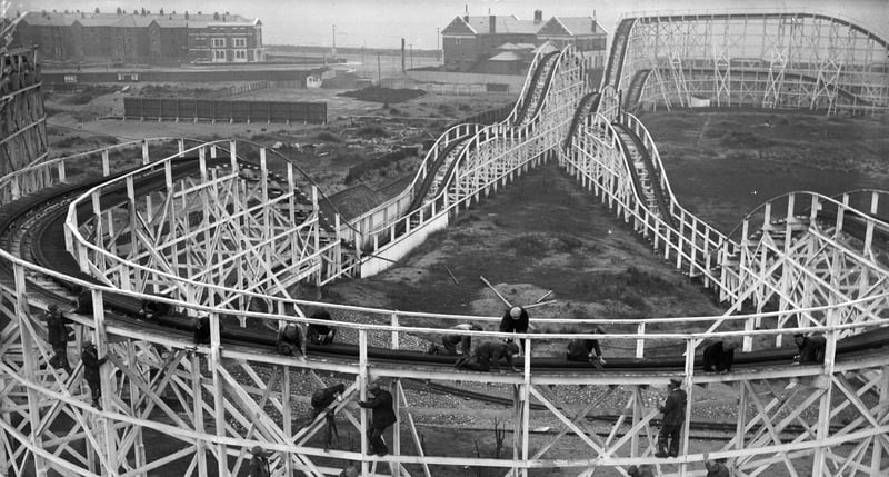 26th March 1934:  Men at work on the Big Dipper at the Pleasure Beach (Photo by Reg Speller/Fox Photos/Getty Images)