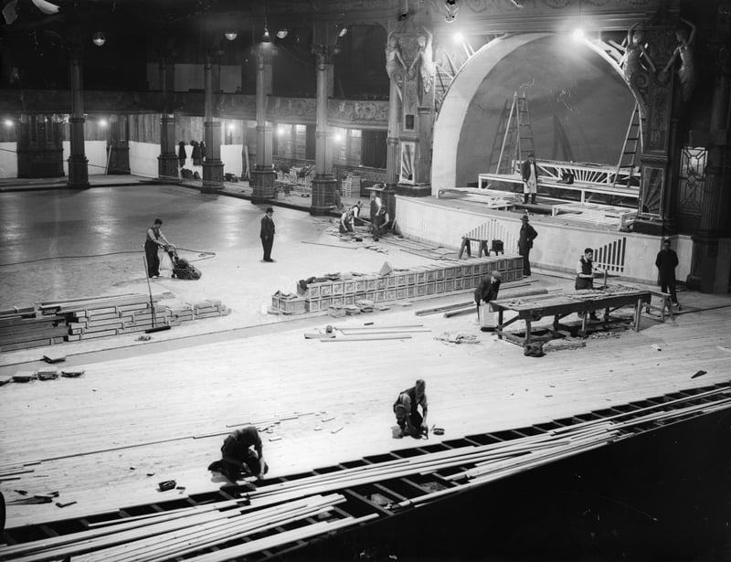 27th November 1934:  Workers laying a new floor in the Empress Ballroom at the Winter Gardens. A quarter of a million planks of wood are being fitted together onto joists supported by springs.  (Photo by Harry Todd/Fox Photos/Getty Images)