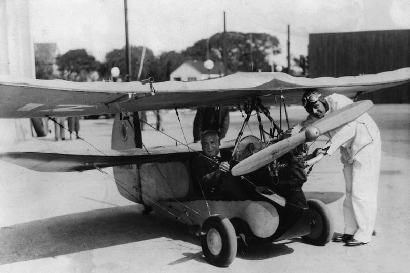The Mayor of Blackpool Ald G Whittaker JP Sits in the tiny cockpit of a miniature plane which visited Stanley Park aerodrome in 1935
