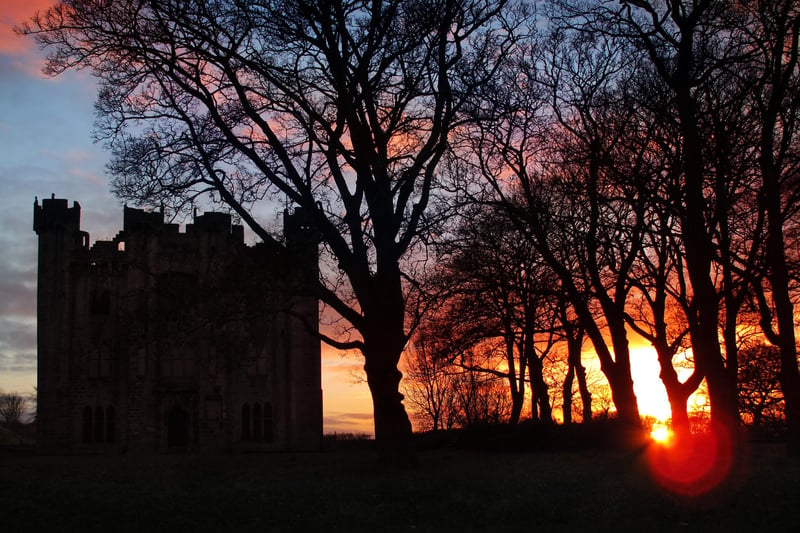 A cold and crisp morning as the mid-winter sun rises alongside Hylton Castle in 2013.