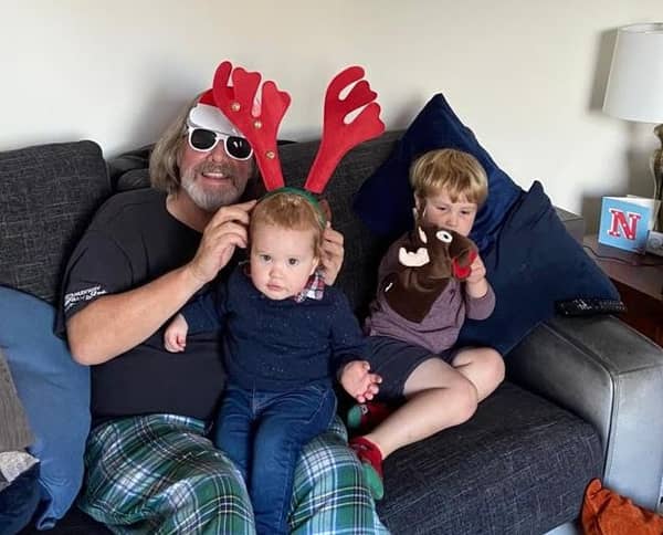 Neil with his two young grandsons.