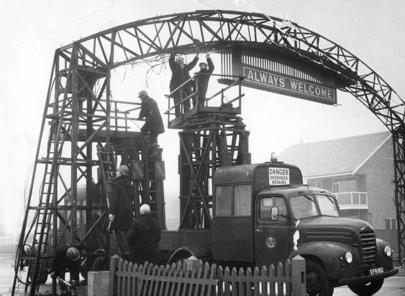 Down it comes...workmen demolish the  famous Welcome Arch at the south end of Blackpool Promenade in January 1969