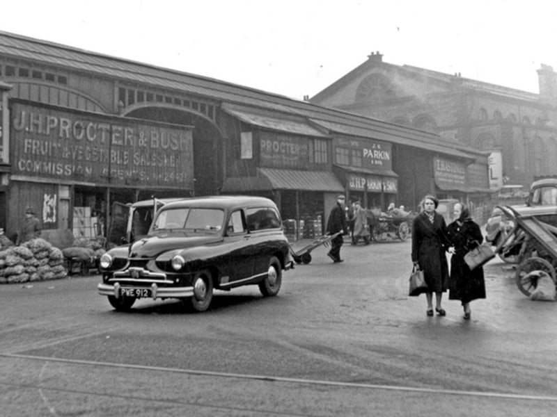 Castlefolds Wholesale Fruit and Vegetable Market, on Exchange Street, Sheffield, with Norfolk Market Hall in the background, pictured in January 1957