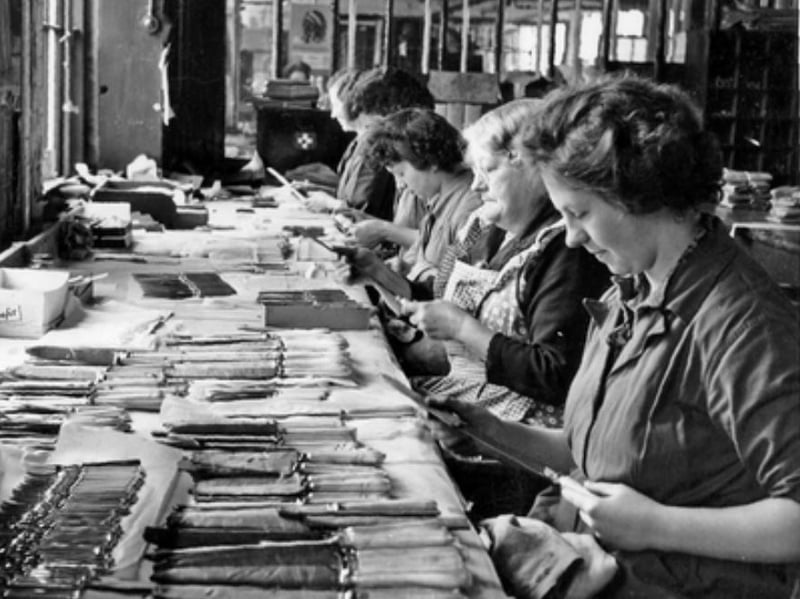 Warehouse staff giving knives a final polish at Mappin and Webb, in Sheffield, in March 1957