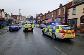 Police at the scene of a shooting on Page Hall Road, Sheffield, which has left a 19-year-old in hospital with life-threatening injuries