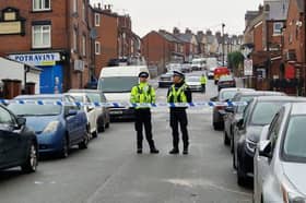 Police at the scene of a shooting on 
on December 12 on Page Hall Road, Sheffield, which has left a 19-year-old in hospital with life-threatening injuries.