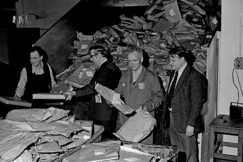 Sorting through the Christmas parcels in December 1977.