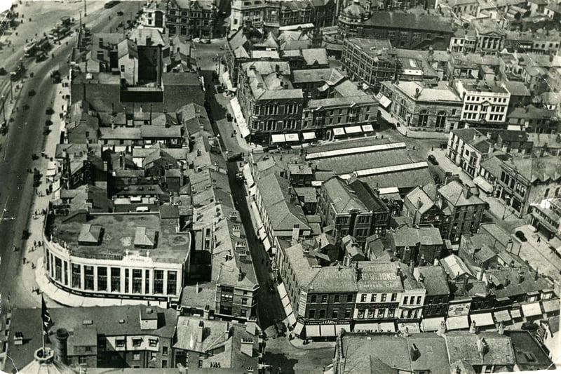 Aerial view from Blackpool Tower looking North.
Market Street ( in the centre ) runs parallel with the Promenade and Corporation Street on the right.
The long roofs of the old St John's Market and Boots Chemist are in the centre with the town hall and Yates's Wine Lodge are at the top. H Samuel is in the same position as today, on the corner of Church Street and Bank Hey Street.  Also on church street are Alexandre taylors, Parker's Restaurant and cafe and Dicks shoes
