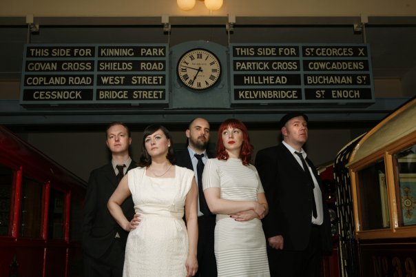 Camera Obscura were formed in Glasgow in 1996 by Tracyanne Campbell, John Henderson and Gavin Dunbar. The bands first album Biggest Bluest Hi Fi was produced by Belle and Sebastian lead singer Stuart Murdoch. 