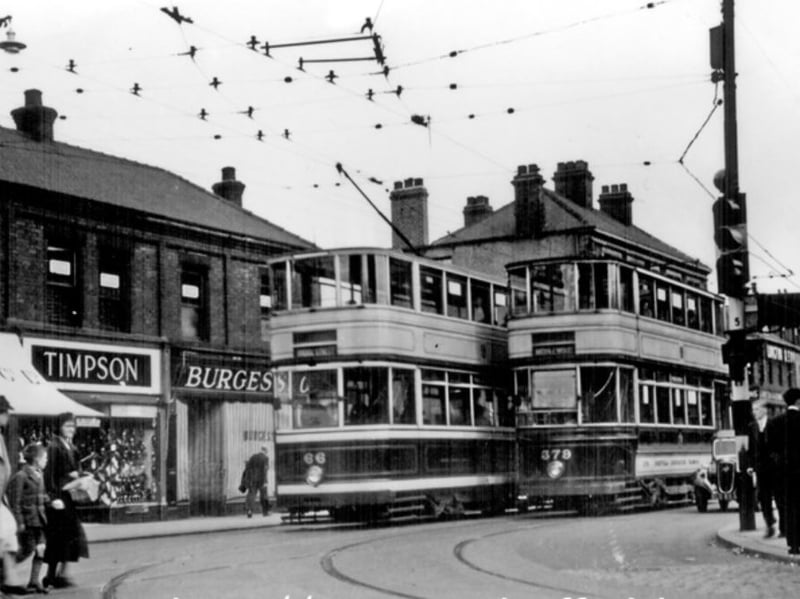 Langsett Road, Sheffield, opposite the junction with Bradfield Road, in 1936. Pictured are Meadow Dairy Co, Wm. Timpson Ltd, and Burgess and Co tailors, below Harry Bottom's billiard hall