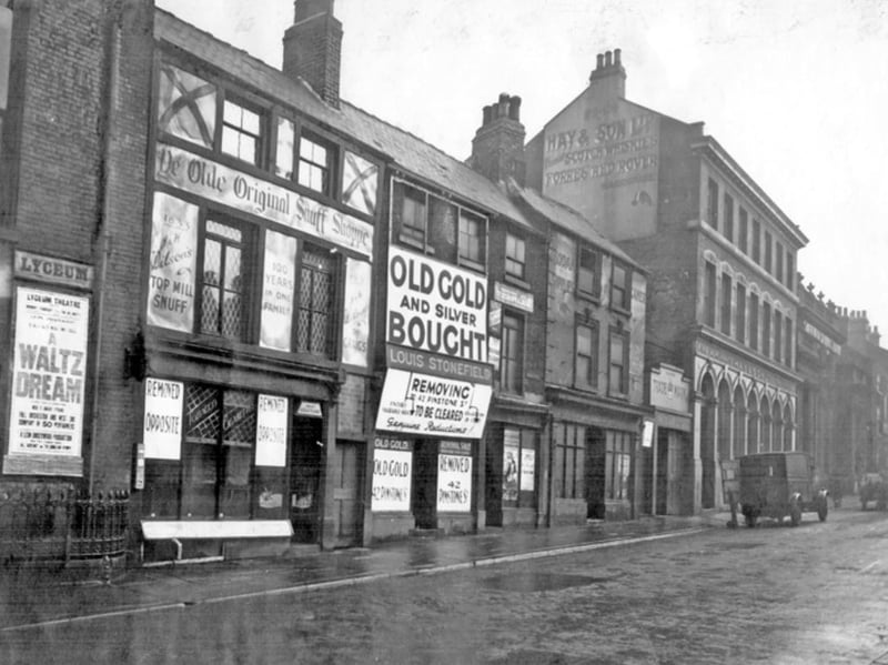 Norfolk Street, Sheffield, in February 1936, with the premises shown including Ye Olde Original Snuff Shoppe; Louis Stonefield, jeweller; Hay and Son Ltd, wine and spirit merchants (Furnival Chambers); and the Assembly Rooms