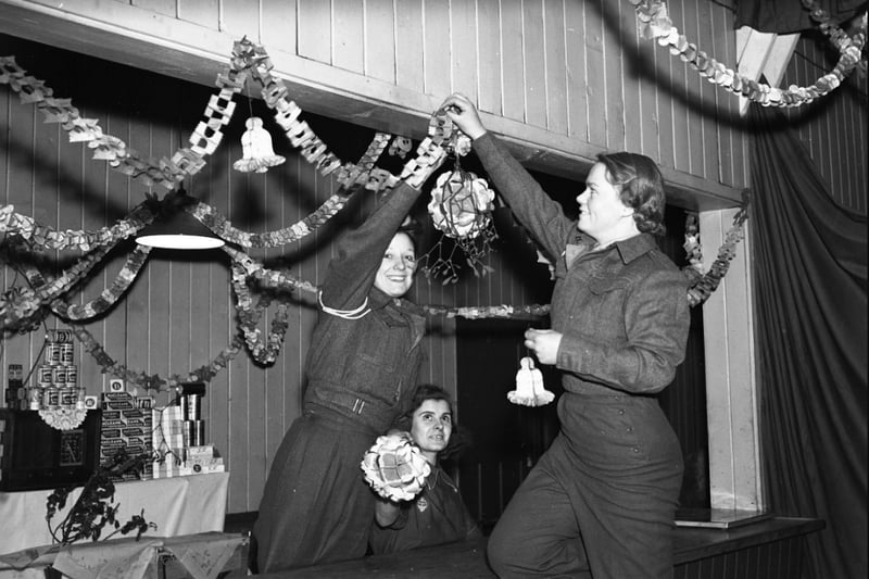 It's December 23, 1941, and these ATS girls stationed on Wearside decorate the canteen where their Christmas festivities were being held.