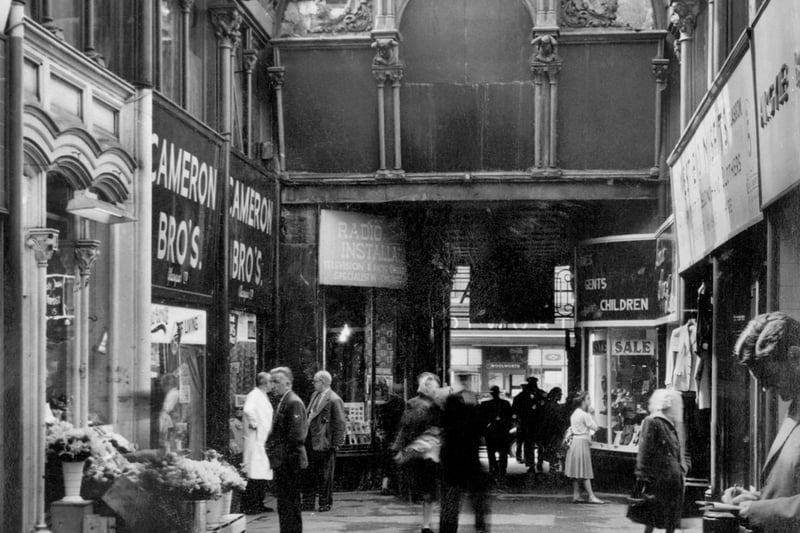 The Queens Arcade was demolished in 1966 but had been a popular spot for Christmas shoppers for years with it containing a variety of small shops. 