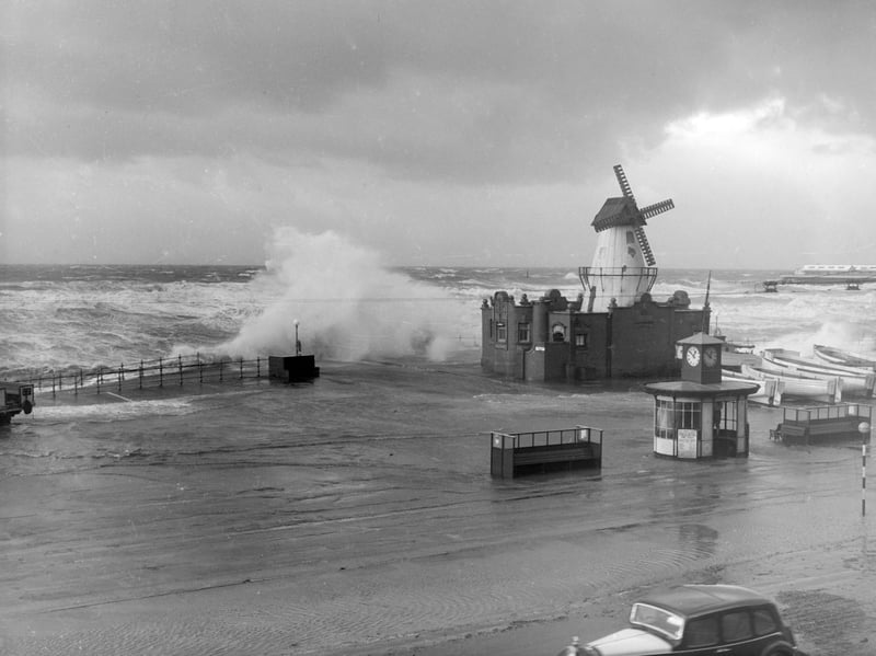 The windmill between South Pier and Central Pier ( close to the Manchester Hotel) is battered by the stormy sea in 1951