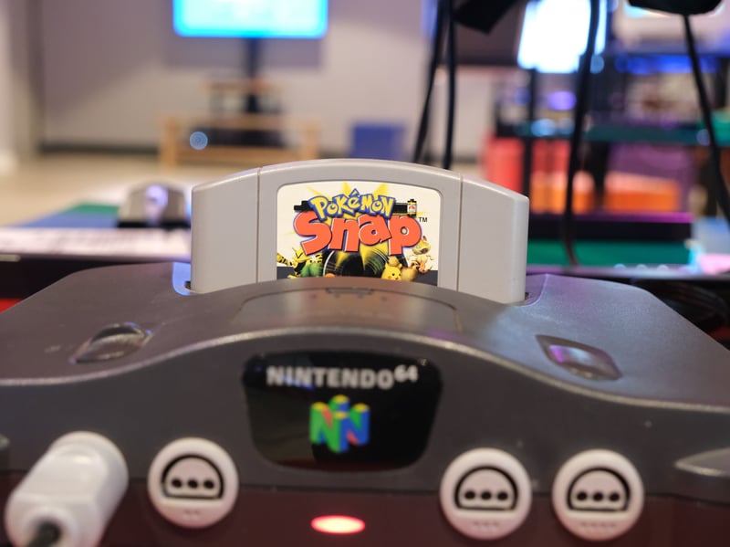 Pokémon Snap (1999, Nintendo 64) is a first-person rail shooter photography game. It is a spin off from the (very popular) Pokémon games. The player is summoned to Pokémon Island to help Professor Oak make a visual record of the Pokémon he’s studying. Leah Dungay, learning officer at the NVM, said: "One of my earliest gaming memories is the classic photography game Pokemon Snap on the Nintendo 64, which is playable in our new Photography exhibit! I would have been around nine years old and received a special Pikachu edition of the N64 for a birthday or maybe Christmas one year. Turning on Pokemon Snap, it plays the introductory cut scene of Todd the photographer trying to take a picture of the elusive pokemon Mew. It was mysterious, cinematic and to my nine-year-old eyes, the best thing I’d ever seen. Me and my avid photographer dad then put hundreds of hours of playtime to photograph all the Pokemon we could find. The Pikachu N64 was from then on a staple in our household, with my family and I playing countless hours of Pokemon Stadium and Diddy Kong Racing a few years later. I’m very happy to say that I still have this precious console in my collection!”