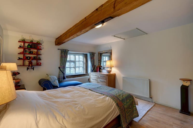 The double bedroom also has side-facing window, an exposed wooden beam, flush light point, central heating radiators and timber flooring. Access can also be gained to a loft space.