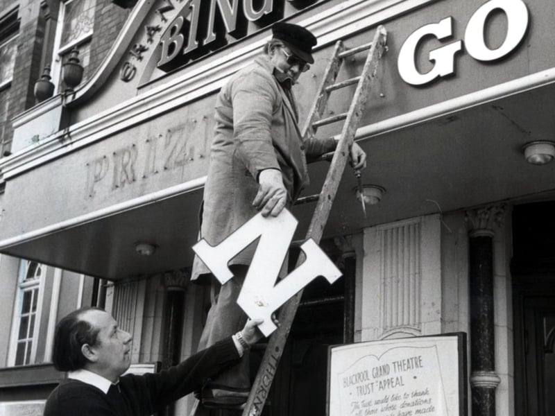 Grand Theatre Assistant administrator John Shedwick and maintenance supervisor James Smith remove the traces of the bingo image from the theatre
