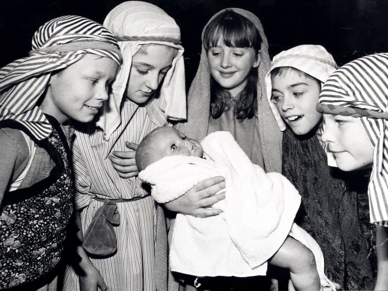 Mary and Joseph Claire Allen and Carl Courtney, fourth left, both then aged 11, are pictured holding baby Jesus in this shot from a 1988 nativity play in Sheffield. Looking on are shepherds Paul Roe, 9, Steven Parkin, 11, and Wayne Cousins, aged 10.