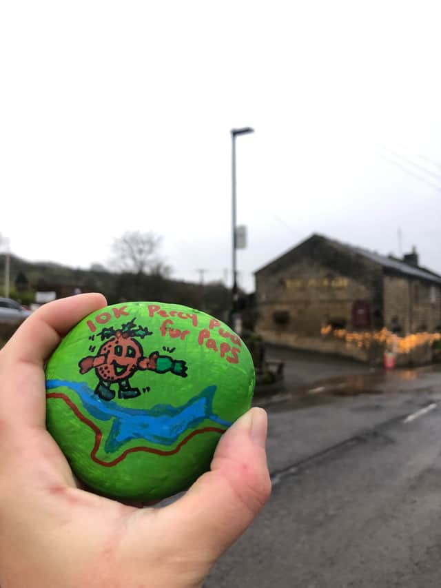Rebekah's decorative pebble for the Percy Pud 2023. After the 'race', she went to see Paprika in Wisewood Cemetery and left it at her grave with all her family and friends' other pebbles.