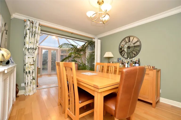 The separate dining room has access to the living room and conservatory via two set of double doors.