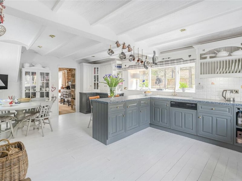 A spacious breakfast kitchen sits to the rear of the property.