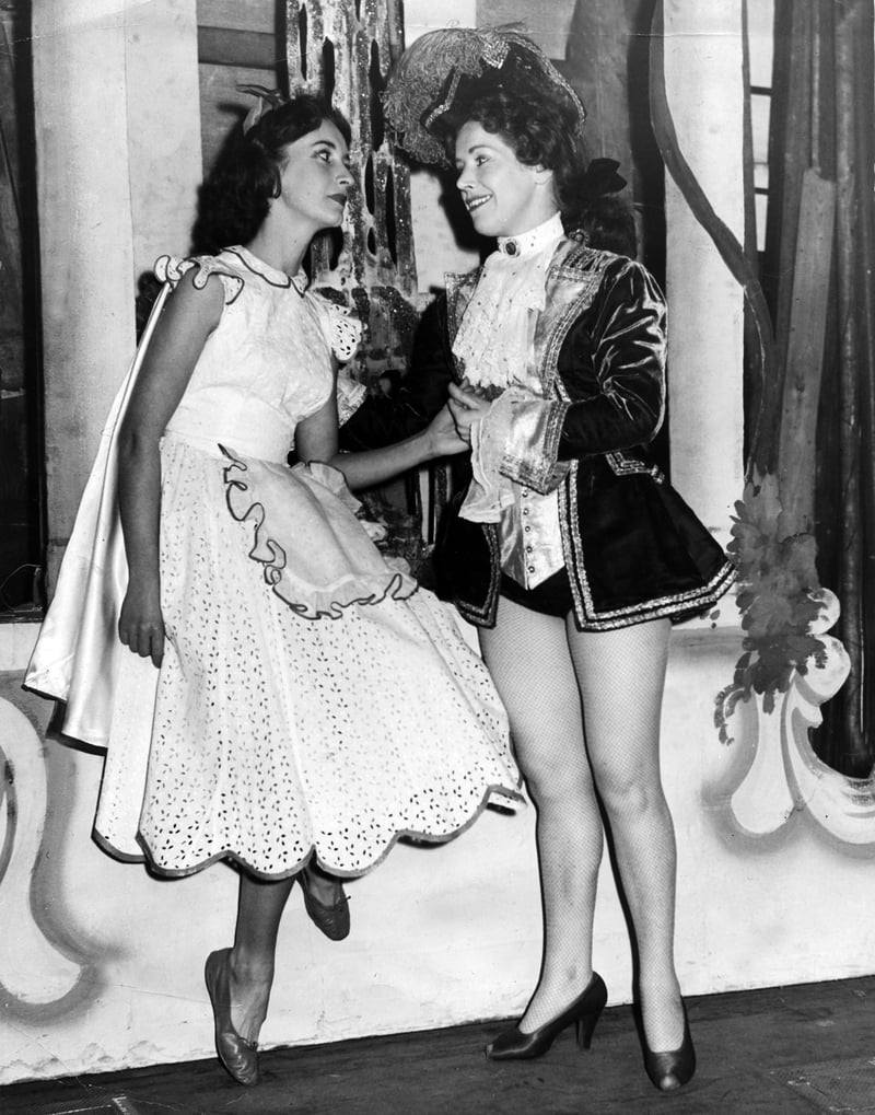 Prince Valiant (Mary Harkness) serenades Red Riding Hood (Barbara Haydn) during the pantomime dress rehearsal at the Sheffield Lyceum Theatre, in December 1955